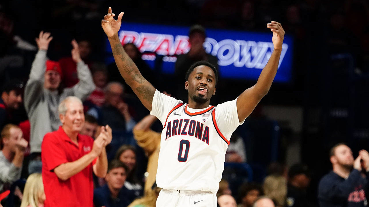 Arizona's Courtney Ramey (0) celebrates after a dunk over Morgan State during the second half of an...