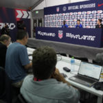 
              Tim Weah, top left, and Christian Pulisic, top center, both of the United States, attend a press conference before a training session at Al-Gharafa SC Stadium, in Doha, Thursday, Dec. 1, 2022. Director of Communications Michael Kammarman is at top right. (AP Photo/Ashley Landis)
            