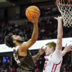 
              Lehigh's Tyler Whitney-Sidney (22) shoots against Wisconsin's Steven Crowl during the first half of an NCAA college basketball game Thursday, Dec. 15, 2022, in Madison, Wis. (AP Photo/Andy Manis)
            
