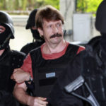 
              FILE - Suspected Russian arms smuggler Viktor Bout, center, is led by armed Thai police commandos as he arrives at the criminal court in Bangkok, Thailand in Oct. 5, 2010. Russia has freed WNBA star Brittney Griner on Thursday in a dramatic high-level prisoner exchange, with the U.S. releasing notorious Russian arms dealer Viktor Bout.  (AP Photo/Apichart Weerawong, File)
            