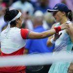 
              FILE - Iga Swiatek, of Poland, right, greets Ons Jabeur, of Tunisia, after winning the women's singles final of the U.S. Open tennis championships on Sept. 10, 2022, in New York. Swiatek and Jabeur are two of the tennis players featured in the new Netflix docuseries “Break Point,” which is scheduled to debut on Jan. 13, 2023. The show is from the producers of “Formula 1: Drive to Survive.” (AP Photo/Matt Rourke, File)
            