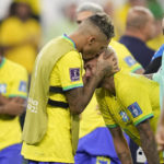 Brazil's Neymar is embraced by Brazil's Raphinha at the end of the World Cup quarterfinal soccer match between Croatia and Brazil, at the Education City Stadium in Al Rayyan, Qatar, Friday, Dec. 9, 2022. (AP Photo/Darko Bandic)
