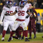 New York Giants running back Saquon Barkley (26) celebrates a first down run during the second half of an NFL football game against the Washington Commanders, Sunday, Dec. 18, 2022, in Landover, Md. (AP Photo/Susan Walsh)