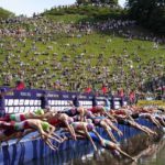 
              Athletes start in the men's Triathlon during the European Championships in Munich, Germany, Saturday, Aug. 13, 2022. (AP Photo/Martin Meissner)
            