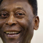 
              FILE - Brazilian soccer legend Pele smiles during a media opportunity at a restaurant in London, March 20, 2015. Pelé, the Brazilian king of soccer who won a record three World Cups and became one of the most commanding sports figures of the last century, died in Sao Paulo on Thursday, Dec. 29, 2022. He was 82. (AP Photo/Kirsty Wigglesworth, File)
            