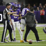 Minnesota Vikings wide receiver Justin Jefferson (18) is helped off the field after getting injured during the second half of an NFL football game against the Indianapolis Colts, Saturday, Dec. 17, 2022, in Minneapolis. (AP Photo/Andy Clayton-King)