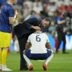 
              England's head coach Gareth Southgate comforts England's Harry Maguire at the end of the World Cup quarterfinal soccer match between England and France, at the Al Bayt Stadium in Al Khor, Qatar, Sunday, Dec. 11, 2022. France won 2-1. (AP Photo/Francisco Seco)
            