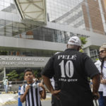 
              Santos soccer team supporters gather at a prayer vigil for the recovery of former soccer star Pele, in front of the Albert Einstein hospital where Pele is hospitalized in Sao Paulo, Brazil, Sunday, Nov. 4, 2022. The 82-year-old Pele has been at the hospital since Tuesday and officials say he is responding well to treatment for a respiratory infection. (AP Photo/Marcelo Chello)
            