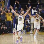 FILE - Golden State Warriors guard Stephen Curry (30) celebrates after guard Klay Thompson, right, shot a 3-point basket during the second half of Game 5 of basketball's NBA Finals against the Boston Celtics in San Francisco, June 13, 2022. (AP Photo/Jed Jacobsohn, File)