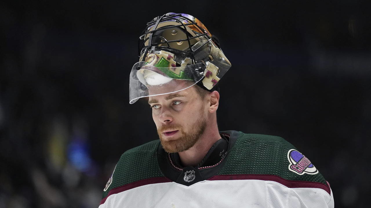 Arizona Coyotes goalie Karel Vejmelka skates during a stoppage in play during the first period of t...