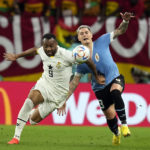 
              Ghana's Jordan Ayew, left, and Uruguay's Guillermo Varela fight for the ball during the World Cup group H soccer match between Ghana and Uruguay, at the Al Janoub Stadium in Al Wakrah, Qatar, Friday, Dec. 2, 2022. (AP PhotoThemba Hadebe)
            