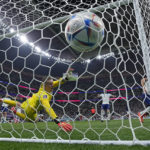 England's goalkeeper Jordan Pickford is beaten by a header from France's Olivier Giroud to scores his side's second goal during the World Cup quarterfinal soccer match between England and France, at the Al Bayt Stadium in Al Khor, Qatar, Saturday, Dec. 10, 2022. (AP Photo/Christophe Ena)