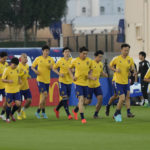 Players warm up during Japan official training on the eve of the World Cup round of 16 soccer match between Japan and Croatia at the in Doha, Qatar, Sunday, Dec. 4, 2022. (AP Photo/Eugene Hoshiko)