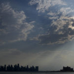 
              The sun is covered by clouds over the skyline of Doha, Qatar, on Thursday, Dec. 8, 2022. (AP Photo/Frank Augstein)
            