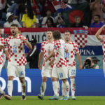 
              Croatia's Ivan Perisic, right, celebrates after scoring his side's first goal during the World Cup round of 16 soccer match between Japan and Croatia at the Al Janoub Stadium in Al Wakrah, Qatar, Monday, Dec. 5, 2022. (AP Photo/Frank Augstein)
            