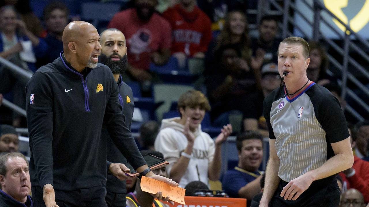 Phoenix Suns head coach Monty Williams, left, argues a call in the first half of an NBA basketball ...