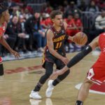 Atlanta Hawks guard Trae Young (11) dribbles the ball during the second half of an NBA basketball game against the Chicago Bulls on Wednesday, Dec. 21, 2022, in Atlanta. (AP Photo/Erik Rank)