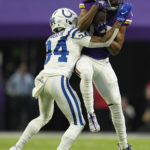Minnesota Vikings wide receiver K.J. Osborn catches a pass ahead of Indianapolis Colts cornerback Isaiah Rodgers (34) during the first half of an NFL football game, Saturday, Dec. 17, 2022, in Minneapolis. (AP Photo/Abbie Parr)