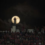 
              A full moon rises over supporters of Wydad Athletic Club during the second leg of the CAF Champions League final against Egypt's Al Ahly Sporting Club, in Casablanca, Morocco, Saturday, Nov. 5, 2017. Wydad defeated Al Ahly 2-1 on aggregate to win the CAF Champions League. (AP Photo/Mosa'ab Elshamy)
            
