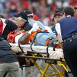 
              FILE - Southern wide receiver Devon Gales (33) is carted off the field after being injured in the second half of an NCAA college football game against Georgia in Athens, Ga., Sept. 26, 2015. Gales, who was left paralyzed, is now a student at Georgia and working to complete his degree communications. (AP Photo/John Bazemore)
            