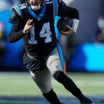 
              Carolina Panthers quarterback Sam Darnold runs during the first half of an NFL football game between the Carolina Panthers and the Detroit Lions on Saturday, Dec. 24, 2022, in Charlotte, N.C. (AP Photo/Rusty Jones)
            