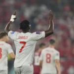 Switzerland's Breel Embolo celebrates after scoring his side's second goal during the World Cup group G soccer match between Serbia and Switzerland, at the Stadium 974 in Doha, Qatar, Friday, Dec. 2, 2022. (AP Photo/Martin Meissner)