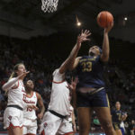 
              Notre Dame's Lauren Ebo (33) goes up to score in the first half of an NCAA college basketball game against Virginia Tech in Blacksburg, Va., Sunday, Dec. 18, 2022. (Matt Gentry/The Roanoke Times via AP)
            