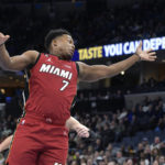 
              Miami Heat guard Kyle Lowry (7) loses control of the ball in the first half of an NBA basketball game against the Memphis Grizzlies, Monday, Dec. 5, 2022, in Memphis, Tenn. (AP Photo/Brandon Dill)
            