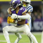 Minnesota Vikings wide receiver Justin Jefferson (18) is tackled by Indianapolis Colts safety Rodney McLeod (26) after catching a pass during the second half of an NFL football game, Saturday, Dec. 17, 2022, in Minneapolis. (AP Photo/Abbie Parr)