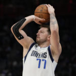 Dallas Mavericks guard Luka Doncic takes a shot during the second half of an NBA basketball game against the Detroit Pistons, Thursday, Dec. 1, 2022, in Detroit. (AP Photo/Carlos Osorio)