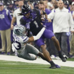 
              TCU wide receiver Quentin Johnston (1) is tackled by Kansas State cornerback Julius Brents (23) in the first half of the Big 12 Conference championship NCAA college football game, Saturday, Dec. 3, 2022, in Arlington, Texas. (AP Photo/LM Otero)
            