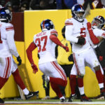 
              New York Giants defensive end Kayvon Thibodeaux (5) is congratulated by teammates after scoring a touchdown during the first half of an NFL football game against the Washington Commanders, Sunday, Dec. 18, 2022, in Landover, Md. (AP Photo/Nick Wass)
            