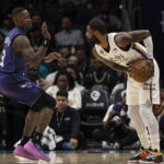 
              Charlotte Hornets guard Terry Rozier (3) defends against Brooklyn Nets guard Kyrie Irving, right, during the first half of an NBA basketball game, Saturday, Dec. 31, 2022, in Charlotte, N.C. (AP Photo/Matt Kelley)
            