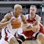 
              Arkansas guard Jordan Walsh tries to drive past Bradley forward Rienk Mast during the first half of an NCAA college basketball game, Saturday, Dec. 17, 2022, in North Little Rock, Ark. (AP Photo/Michael Woods)
            