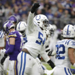 Indianapolis Colts defensive end Dayo Odeyingbo (54) celebrates after stopping Minnesota Vikings running back Dalvin Cook on a fourth down run during the first half of an NFL football game, Saturday, Dec. 17, 2022, in Minneapolis. (AP Photo/Andy Clayton-King)
