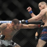 Santiago Ponzinibbio hits Alex Morono during a UFC 282 mixed martial arts catchweight bout Saturday, Dec. 10, 2022, in Las Vegas. (AP Photo/John Locher)