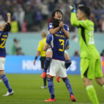 
              Japan players celebrate at the end of the World Cup group E soccer match between Japan and Spain, at the Khalifa International Stadium in Doha, Qatar, Thursday, Dec. 1, 2022. Japan won 2-1. (AP Photo/Julio Cortez)
            