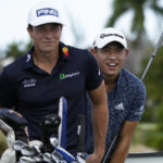 
              Viktor Hovland, of Norway, left, and Collin Morikawa, of the United States, look for the flag on the green before the tee off at the first hole during the first round of the Hero World Challenge PGA Tour at the Albany Golf Club, in New Providence, Bahamas, Thursday, Dec. 1, 2022. (AP Photo/Fernando Llano)
            