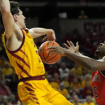 
              Iowa State guard Caleb Grill (2) fouls St. John's guard Montez Mathis (10) on a shot during the first half of an NCAA college basketball game, Sunday, Dec. 4, 2022, in Ames, Iowa. (AP Photo/ Matthew Putney)
            