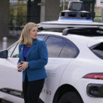 
              Phoenix Mayor Kate Gallego stands beside a self-driving vehicle, Friday, Dec. 16, 2022, at the Sky Harbor International Airport Sky Train facility in Phoenix. Mayor Gallego announced Friday that Sky Harbor will be the first airport to have self-driving, ride-hailing service Waymo available. A test group has been using Waymo vehicles from the airport's sky train to downtown Phoenix since early November.(AP Photo/Matt York)
            