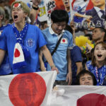 
              Japanese fans celebrate after their team won the World Cup group E soccer match against Germany at the Khalifa International Stadium in Doha, Qatar, Wednesday, Nov. 23, 2022. (AP Photo/Ebrahim Noroozi)
            