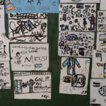 
              Drawings of soccer player Lionel Messi and the Argentine team, made by students at the General Las Heras elementary school where Messi also attended school, are exhibited on a wall at the school in Rosario, Argentina, Wednesday, Dec. 14, 2022. (AP Photo/Rodrigo Abd)
            