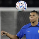 
              France's Kylian Mbappé eyes the ball during a training session in Doha, Qatar, Saturday, Dec. 3, 2022, on the eve of the World Cup soccer match between France and Poland. (AP Photo/Christophe Ena)
            