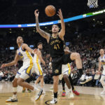 Toronto Raptors forward Juancho Hernangomez (41) looks to receive the ball as Golden State Warriors defenders look on during first-half NBA basketball game action in Toronto, Sunday, Dec. 18, 2022. (Frank Gunn/The Canadian Press via AP)