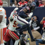 Houston Texans tight end Jordan Akins (88) catches a pass for a touchdown over Kansas City Chiefs linebacker Willie Gay (50) during the second half of an NFL football game Sunday, Dec. 18, 2022, in Houston. (AP Photo/Eric Christian Smith)