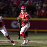 Kansas City Chiefs quarterback Patrick Mahomes drops back to pass during the first half of an NFL football game against the Seattle Seahawks Saturday, Dec. 24, 2022, in Kansas City, Mo. (AP Photo/Charlie Riedel)