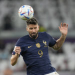 
              France's Olivier Giroud heads the ball during the World Cup round of 16 soccer match between France and Poland, at the Al Thumama Stadium in Doha, Qatar, Sunday, Dec. 4, 2022. (AP Photo/Moises Castillo)
            