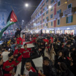 
              Morocco fans celebrate in Milan, Italy, after their victory against Spain in the World Cup round of 16 soccer match between Morocco and Spain, Tuesday, Dec. 6, 2022. (Claudio Furlan/Lapresse via AP)
            