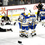 Arizona Coyotes players Christian Fischer (36) Josh Brown (3) goalie Connor Ingram (39) J.J Moser, second from right, and Jack McBain, right, appear dejected as the Buffalo Sabres players celebrate their go-ahead goal in the third period during an NHL hockey game, Saturday, Dec. 17, 2022, in Tempe, Ariz. Buffalo Sabres won 5-2 over the Arizona Coyotes. (AP Photo/Darryl Webb)