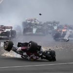 Alfa Romeo driver Guanyu Zhou of China crashes at the start of the British Formula One Grand Prix at the Silverstone circuit, in Silverstone, England, Sunday, July 3, 2022. (AP Photo/Frank Augstein)